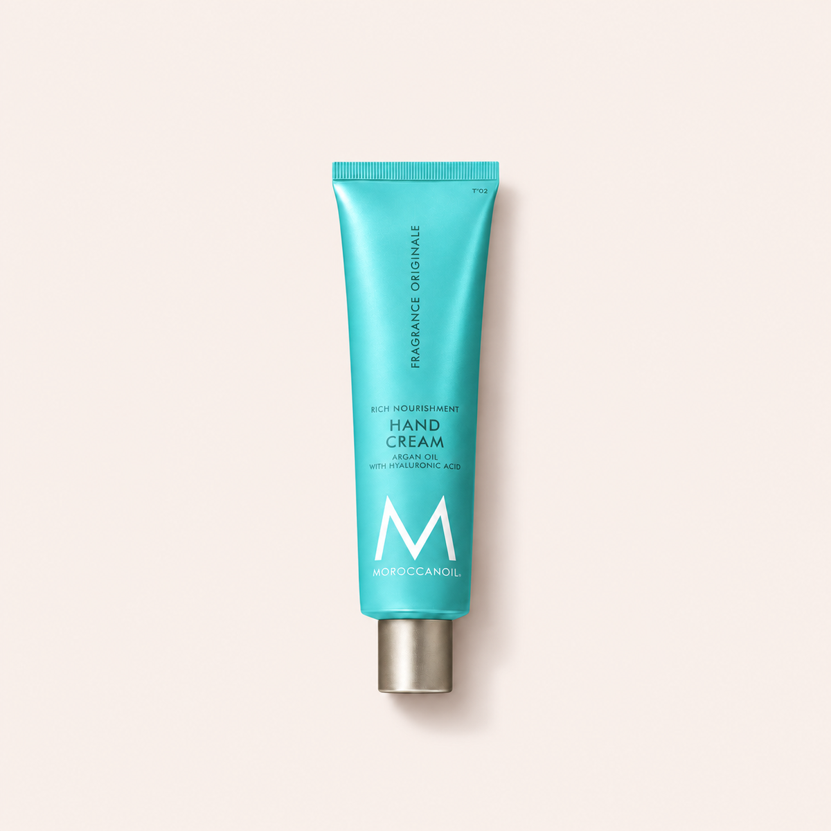 Krém na ruce Moroccanoil Fragrance Originale Hand Cream 100 ml na béžovém pozadí – MrRizz