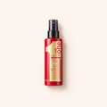 Revlon Professional Uniq One 150 ml na béžovém pozadí – MrRizz
